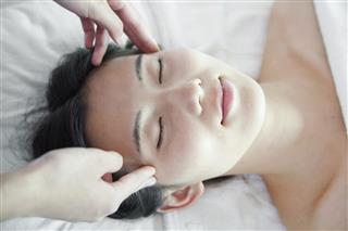 Woman Receiving Head Massage