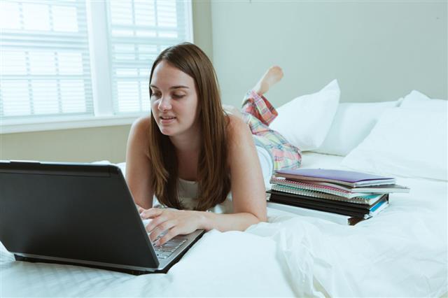 Young Student Studying Using Laptop