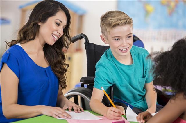 Smiling Student In Wheelchair Talking