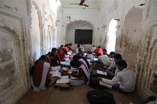 Students Studying In Classroom