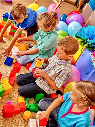 Group Children Game Blocks On Floor