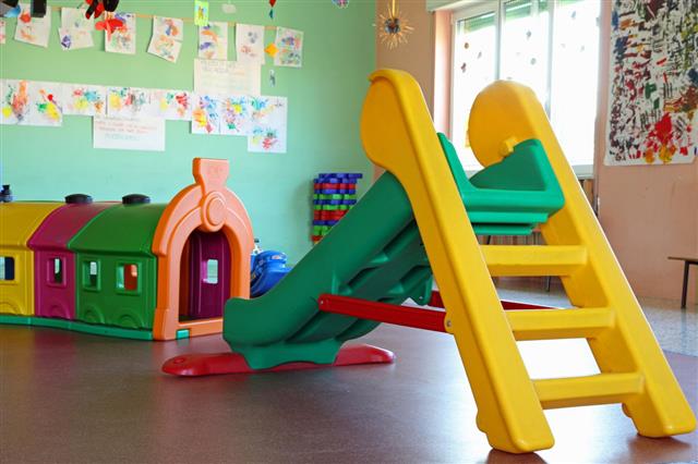 Plastic Slide And Tunnel In Playroom