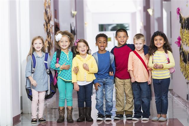 Group Of Children In Preschool Hallway