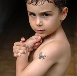 Boy posing tattoo