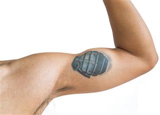 Grenade tattoo on arm