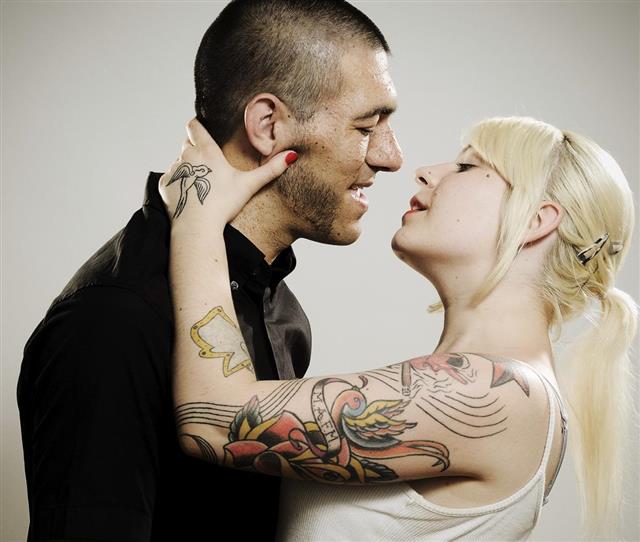 Tattooed woman with partner