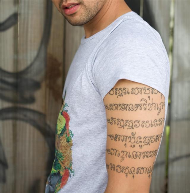 Man with script tattoo