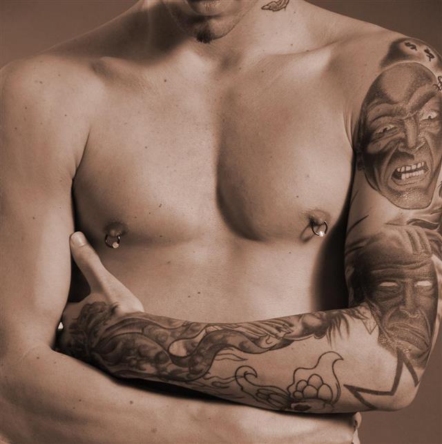 Pierced man with tattoo