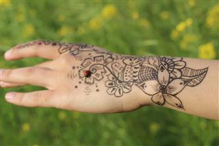 Flower tattoo on girl hand