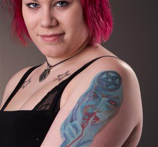 Tattooed woman with red hair