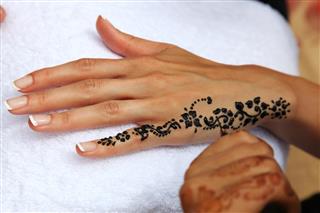 Black Henna Tattoo on hands