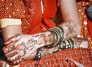 Woman with painted henna hands