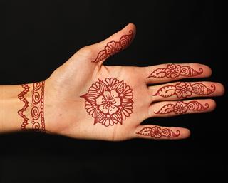 Hand with henna tattoo design