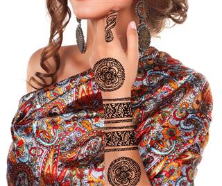 Beautiful woman with henna tattoo