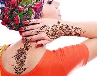 Henna tattoos on female body