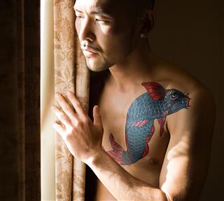 Man with koi fish tattoo
