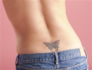 Butterfly tattoo on lower back