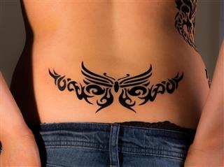 Lower back tribal tattoo