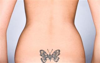 Women with butterfly tattoo