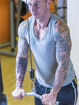 Man with tattoos at gym