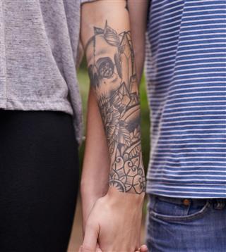 Human hands with tattoo