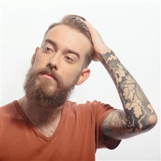 Handsome bearded man with tattoo