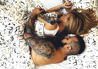 Tattooed Couple Sleeping
