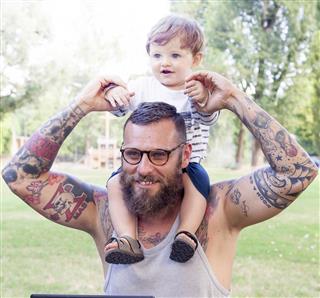 Tattooed dad with his son