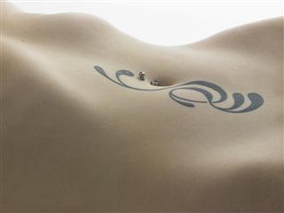 Woman belly tattoo