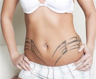 Woman with Belly Tattoo
