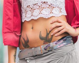 Woman with bird tattoo