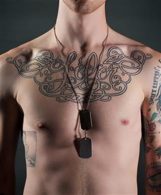 Man with tattoo on chest