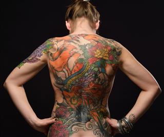 Woman with tattoos on back
