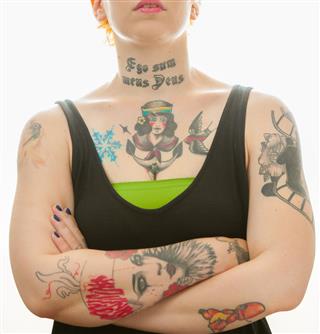 Tattoo girl with folded arms