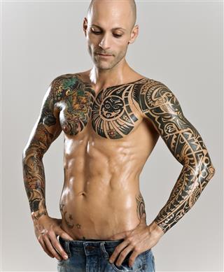 Handsome muscular man with tattoo