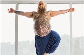 Fat man with tattoos