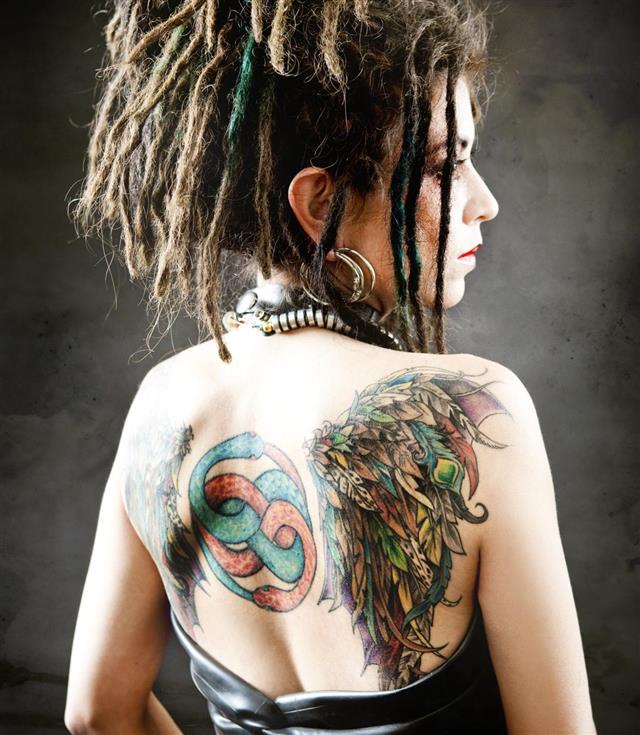 Tattoos on woman back side