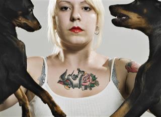 Punk woman carrying dogs