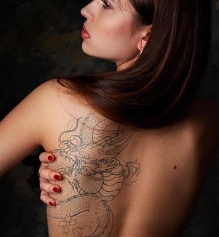 Woman with dragon tattoo