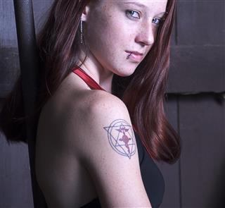 Symbol tattoo woman
