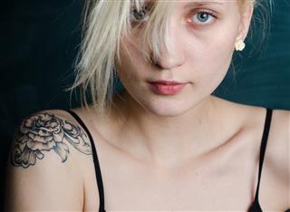 Blonde girl with tattoo