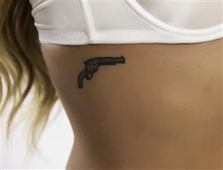 Sexy Model With Gun Tattoo
