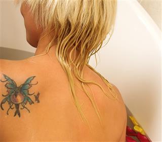 Woman with back tattoo