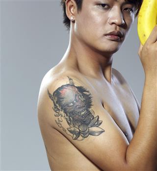 Tattoo Chinese Man Holding A Banana