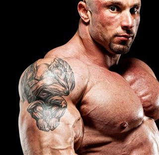 Bodybuilder Showing Big Biceps