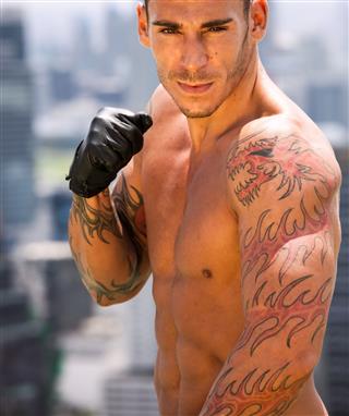 Muscular Fighter With Tattoos
