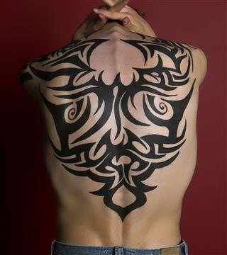 Tribal Tattoo On His Back