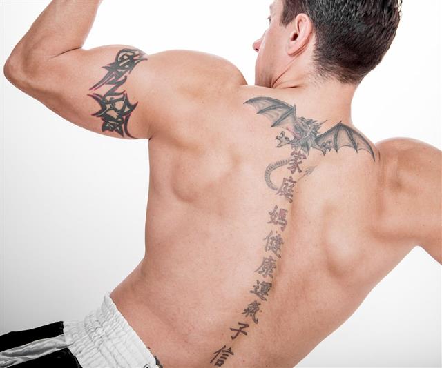 Muscular Back With Tattoo