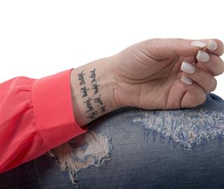 Text tattoo on wrist