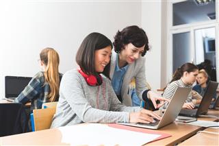 Female Students Learning Computer Programming
